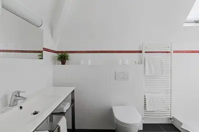 Salle de bains dans l'établissement Hôtel Cardinal