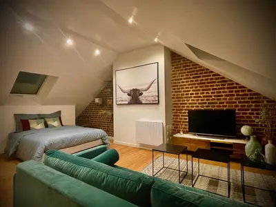 Un ou plusieurs lits dans un hébergement de l'établissement DOWNTOWN LOFT - CENTRE VILLE - WiFi - NETFLIX