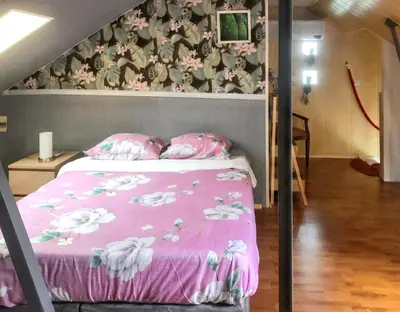 Un ou plusieurs lits dans un hébergement de l'établissement Villa charmante à Saint-Martin-Longueau avec piscine privée