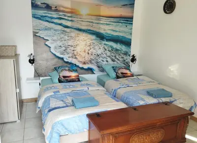 Un ou plusieurs lits dans un hébergement de l'établissement Studio à la mer