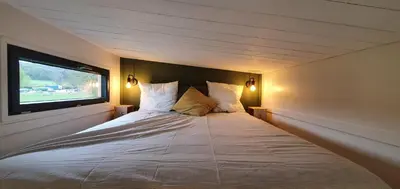 Un ou plusieurs lits dans un hébergement de l'établissement Tiny House Centre équestre - 35 mins de Paris