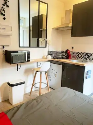 Cuisine ou kitchenette dans l'établissement Studio Netflix & Bed