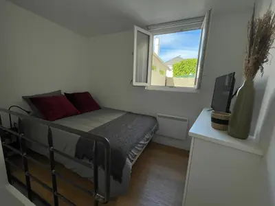 Un ou plusieurs lits dans un hébergement de l'établissement Jolie duplex central climatisé