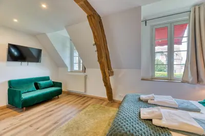 Un ou plusieurs lits dans un hébergement de l'établissement Le Clos des Roches