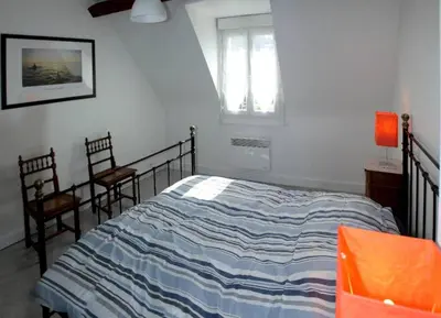 Un ou plusieurs lits dans un hébergement de l'établissement Villa Normande