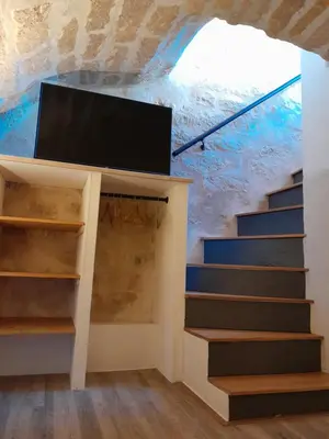 Télévision ou salle de divertissement dans l'établissement Gite de la Reine Blanche