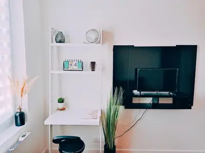 Télévision ou salle de divertissement dans l'établissement Irziana - Au jardin d'Henriville