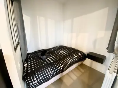 Un ou plusieurs lits dans un hébergement de l'établissement Henry II - petit appartement lumineux - 013