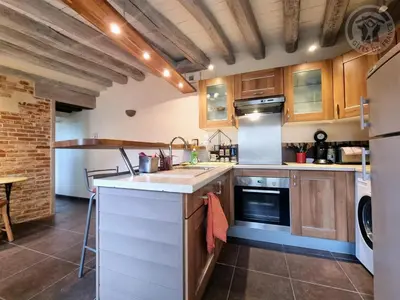 Cuisine ou kitchenette dans l'établissement La Maison de Nicole