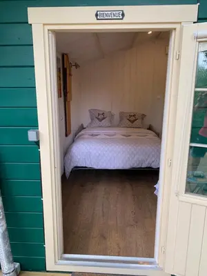 Un ou plusieurs lits dans un hébergement de l'établissement Chalet cosy bord de Seine 30min paris