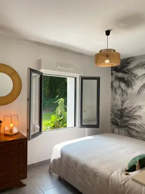 Un ou plusieurs lits dans un hébergement de l'établissement La Maison des Vacances, à deux pas de la mer.