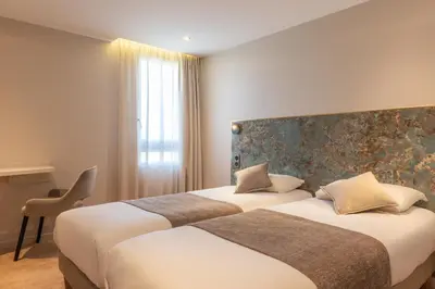 Un ou plusieurs lits dans un hébergement de l'établissement Hôtel d'Angleterre Rouen Centre Gare