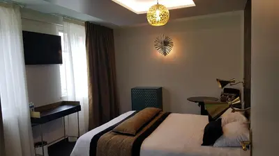 Un ou plusieurs lits dans un hébergement de l'établissement Hôtel d'Angleterre Rouen Centre Gare