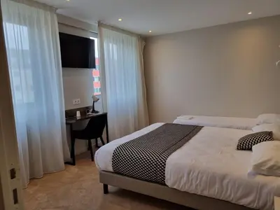 Un ou plusieurs lits dans un hébergement de l'établissement Hôtel d'Angleterre Rouen Centre Gare
