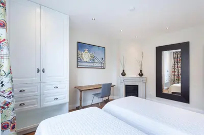 Un ou plusieurs lits dans un hébergement de l'établissement Les appartements de Chantilly - gare