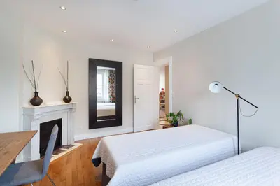 Un ou plusieurs lits dans un hébergement de l'établissement Les appartements de Chantilly - gare
