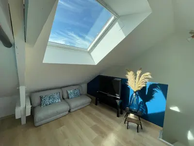 Coin salon dans l'établissement Appartement Les Jardins de Jules Verne - Côté Mer