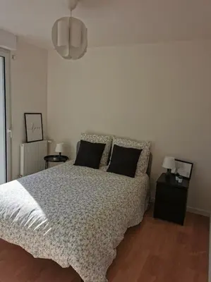 Un ou plusieurs lits dans un hébergement de l'établissement Maison cosy entre Paris Rouen et Deauville