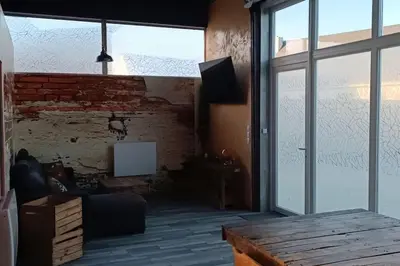 Télévision ou salle de divertissement dans l'établissement Dormir à l'usine Loft industriel Atypique