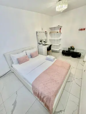 Un ou plusieurs lits dans un hébergement de l'établissement Agréable chambre