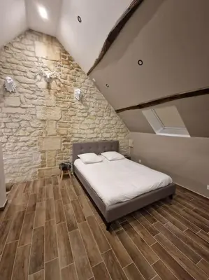 Un ou plusieurs lits dans un hébergement de l'établissement Suite Chalet avec jacuzzi YaoSpa60
