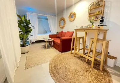 Coin salon dans l'établissement L'instant Bornéo Superbe appartement avec jacuzzi