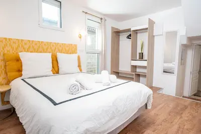 Un ou plusieurs lits dans un hébergement de l'établissement L'Air des Falaises - appartement confort Tréport