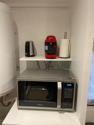 Cuisine ou kitchenette dans l'établissement Le Bassam, proche aéroport