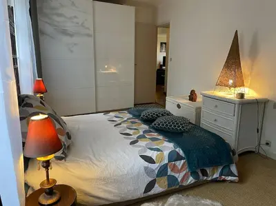 Un ou plusieurs lits dans un hébergement de l'établissement Appartement sur le parvis de la cathédrale