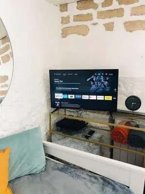 Télévision ou salle de divertissement dans l'établissement Cocooning little house in french Vexin