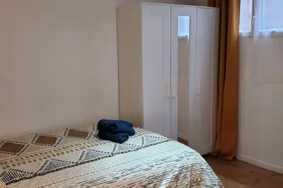 Un ou plusieurs lits dans un hébergement de l'établissement Tulsa Home - Superbe appartement de deux chambres - avec terrasse privée