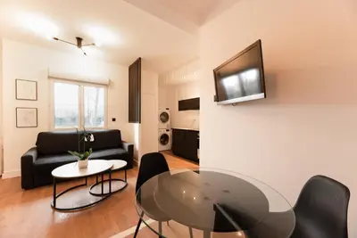 Télévision ou salle de divertissement dans l'établissement Appartement Le Médicis - 2 chambres