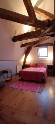 Un ou plusieurs lits dans un hébergement de l'établissement Chantilly Villa Quincampoix