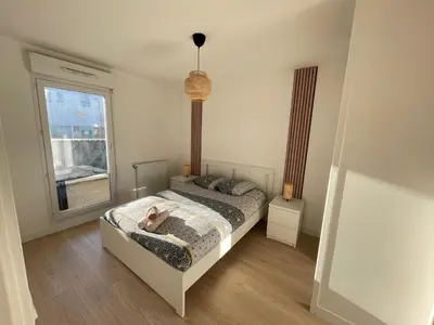 Un ou plusieurs lits dans un hébergement de l'établissement Bel appartement pour 6 avec parking - Rive gauche - 183