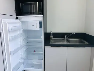 Cuisine ou kitchenette dans l'établissement Maison Gabriel Appartement PLUME