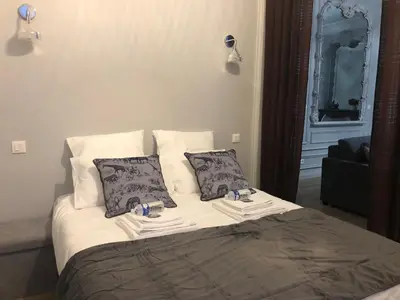 Un ou plusieurs lits dans un hébergement de l'établissement Maison Gabriel Appartement PLUME