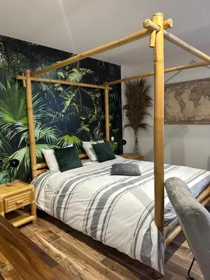 Un ou plusieurs lits dans un hébergement de l'établissement Jungle room