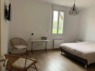 Un ou plusieurs lits dans un hébergement de l'établissement Gîte, Maison entière avec billard et bel espace de vie La Grange