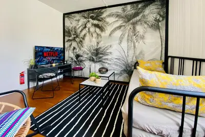 Un ou plusieurs lits dans un hébergement de l'établissement La Maison des Plantes, charmante, atypique et cosy pour 4 personnes avec parking et jardin