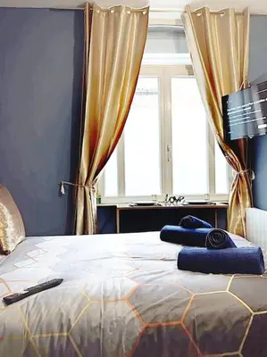 Un ou plusieurs lits dans un hébergement de l'établissement LES MILLE & UNE NUITS ¤ PROCHE GARE ¤ NETFLIX