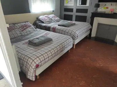 Un ou plusieurs lits dans un hébergement de l'établissement maison julius aeroport tillé 2 a 4 personnes