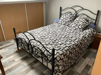 Un ou plusieurs lits dans un hébergement de l'établissement Chambre meublée dans une maison
