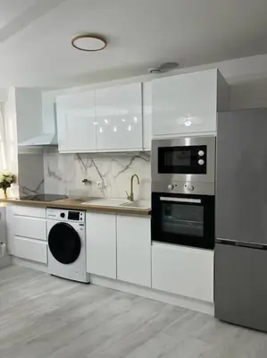 Cuisine ou kitchenette dans l'établissement Beau duplex au centre Ville.