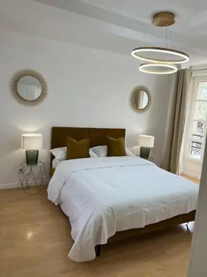 Un ou plusieurs lits dans un hébergement de l'établissement Beau duplex au centre Ville.